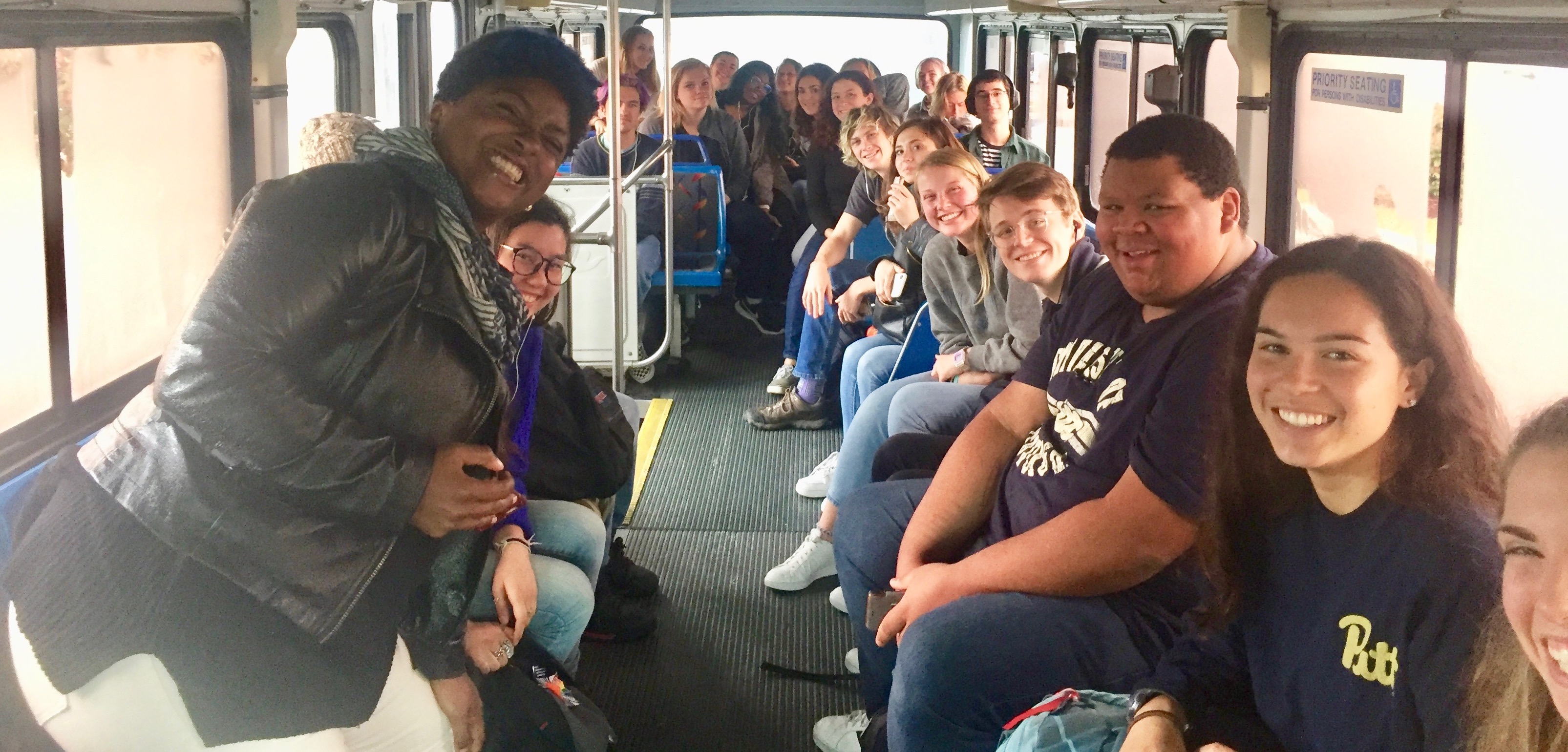 A group of Pitt students on a bus to an Inside-Out course in prison.